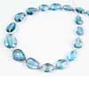 Natural London Blue Topaz Faceted Pear Drop Briolette Beads Length 7 Inches and Size 8mm to 12.5mm approx.Blue topaz is the state gemstone of the US state of Texas. Naturally occurring blue topaz is quite rare and also a birthstone for November. 